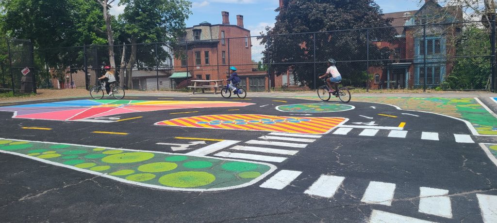A colorful painted streetscape at an unused parking lot.